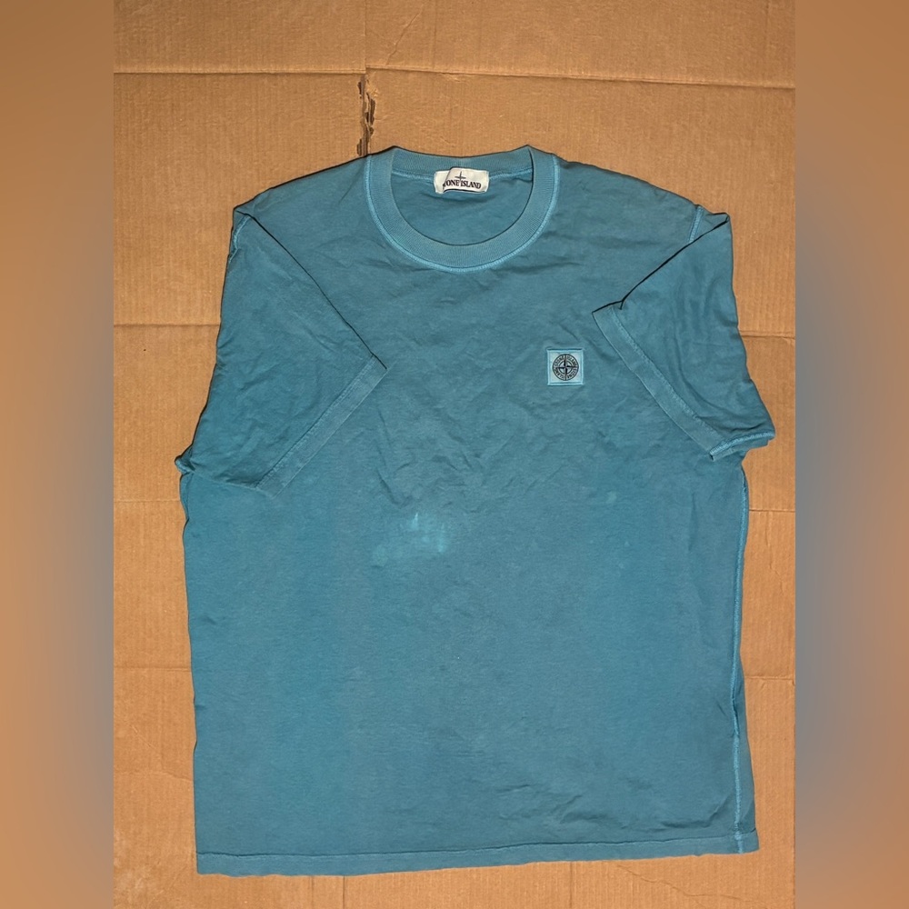 Stone island blue t-shirt.